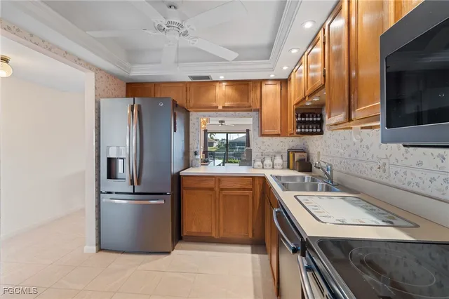 a kitchen with a refrigerator sink and stove