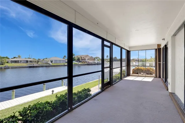 a view of an empty room with a large window