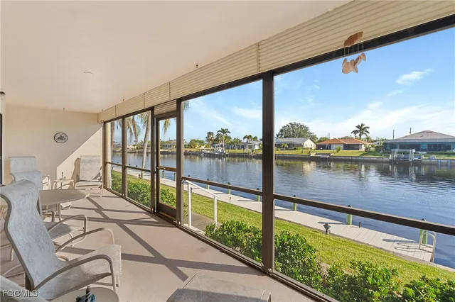 a view of swimming pool with outdoor seating