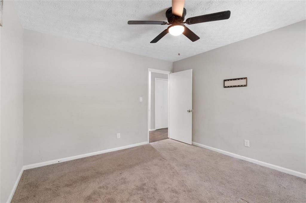 4485 Spring Valley Parkway Atlanta, GA 30349 - Photo 15 of 24 wooden floor in an empty room