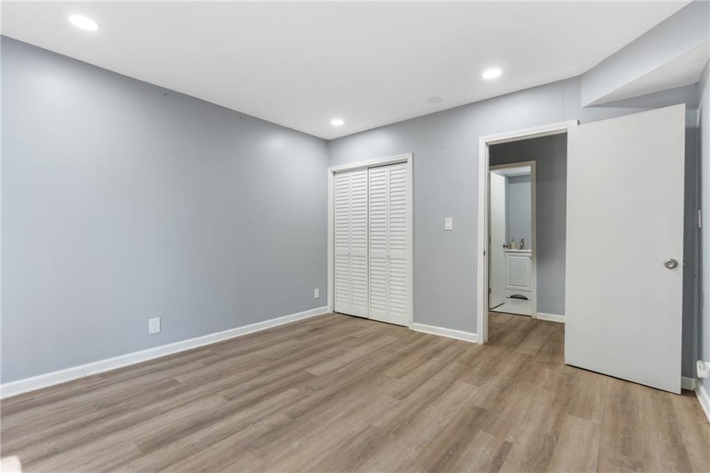 4485 Spring Valley Parkway Atlanta, GA 30349 - Photo 19 of 24 wooden floor in an empty room