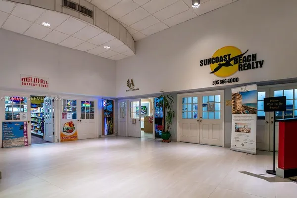 a view of a patio with table and chairs and potted plants