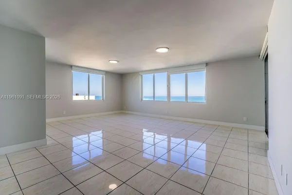 a view of a livingroom with furniture and windows
