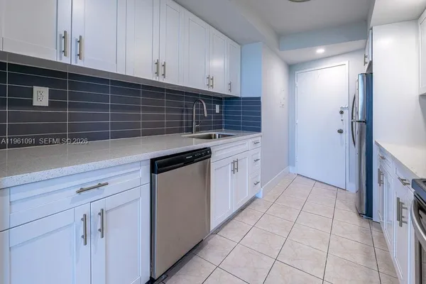 a kitchen with a stove and a microwave
