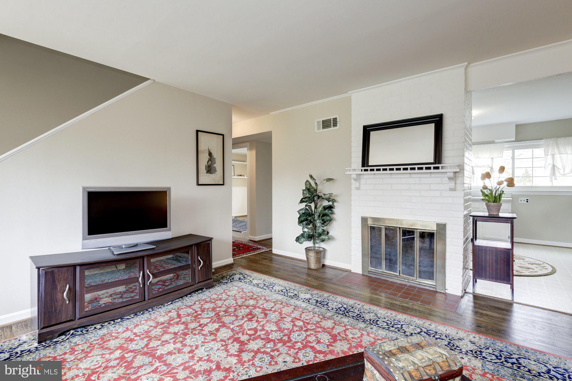 2802 Dawson Avenue Silver Spring, MD 20902 - Photo 12 of 30 a living room with furniture and a fireplace or television