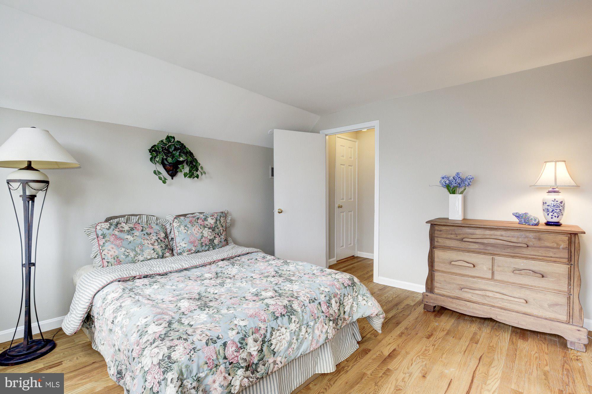 2802 Dawson Avenue Silver Spring, MD 20902 - Photo 23 of 30 a bedroom with a bed and a dresser
