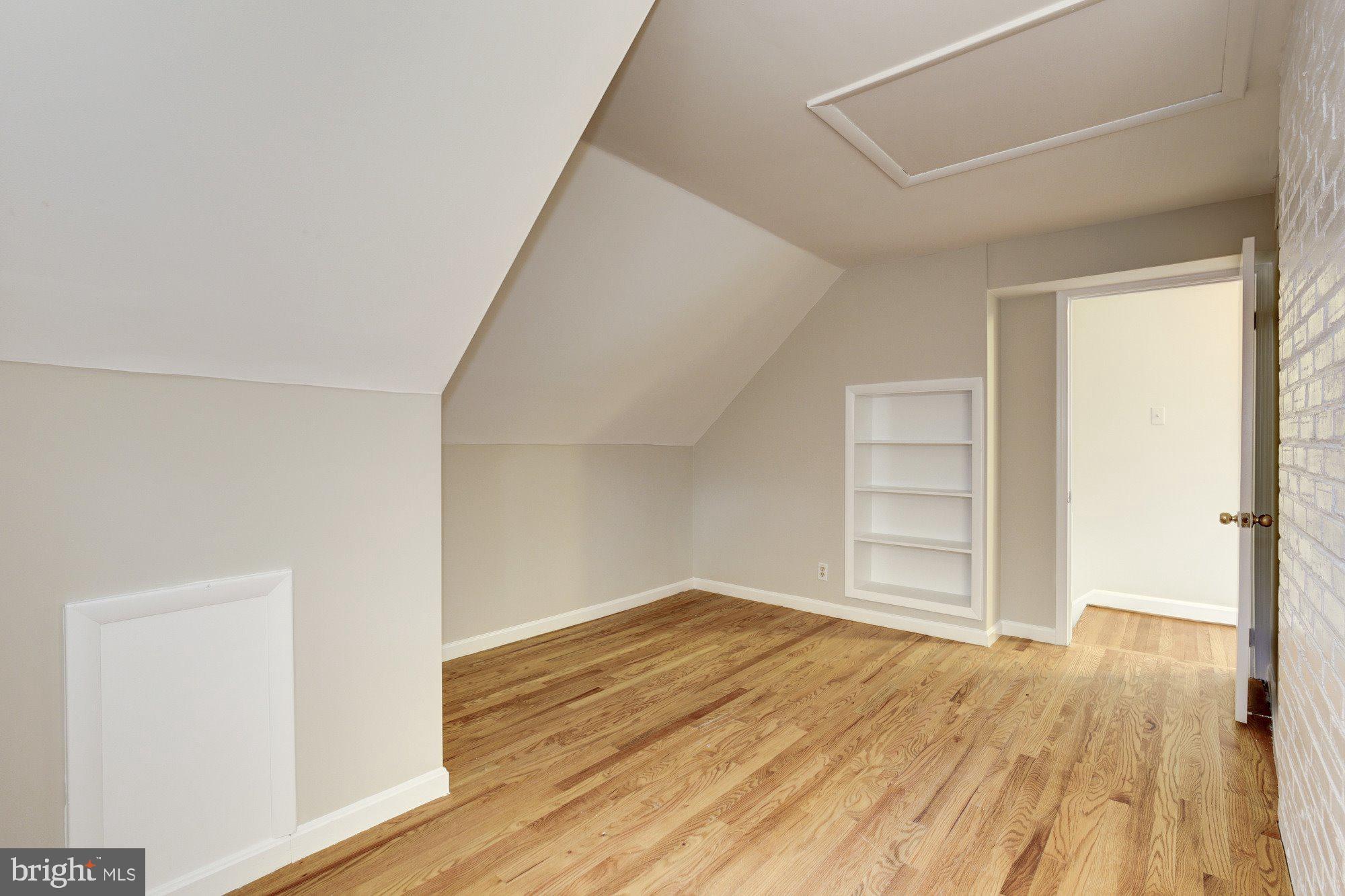 2802 Dawson Avenue Silver Spring, MD 20902 - Photo 25 of 30 a view of empty room with wooden floor and fan
