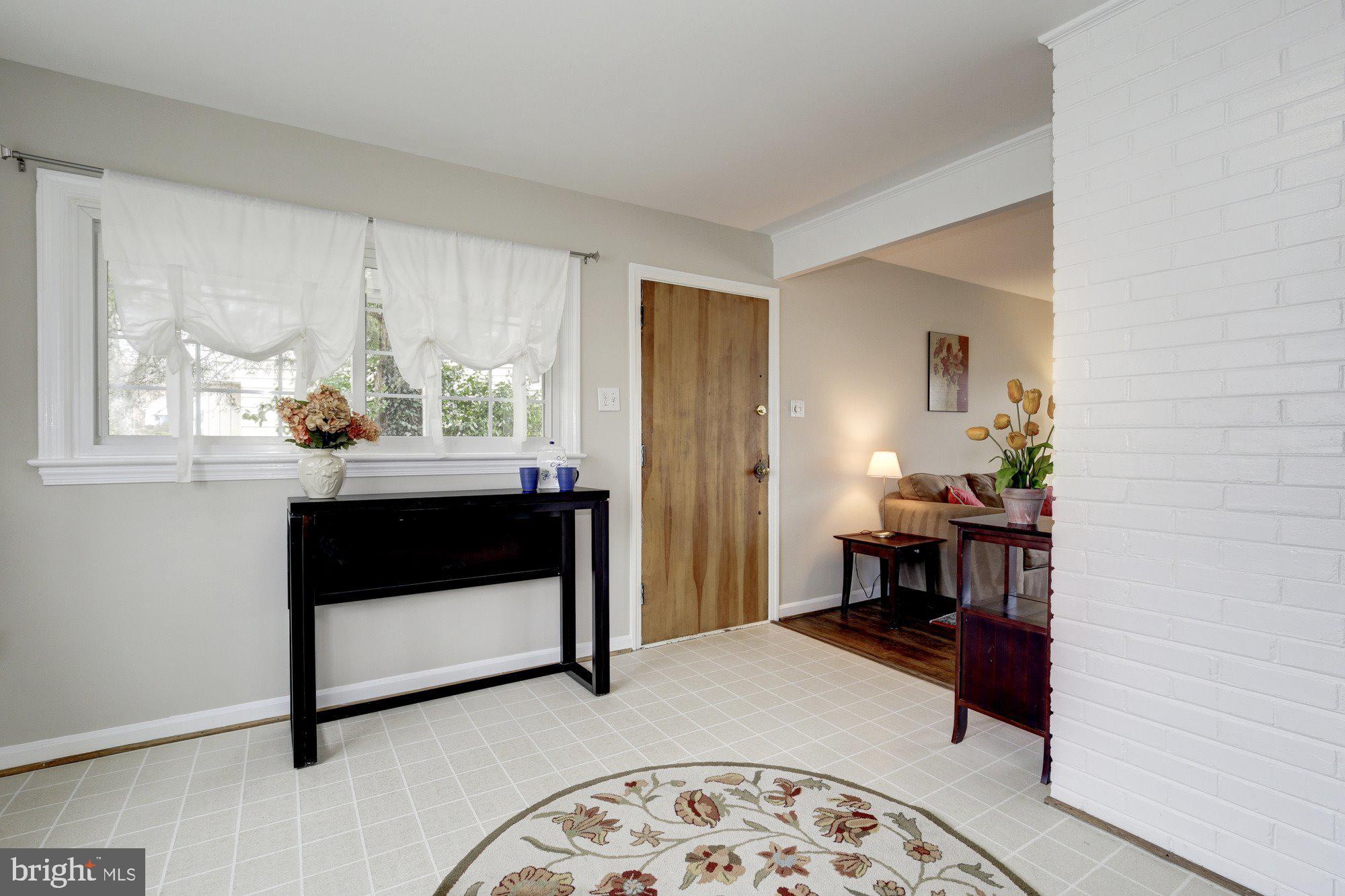 2802 Dawson Avenue Silver Spring, MD 20902 - Photo 7 of 30 a living room with a window and a table