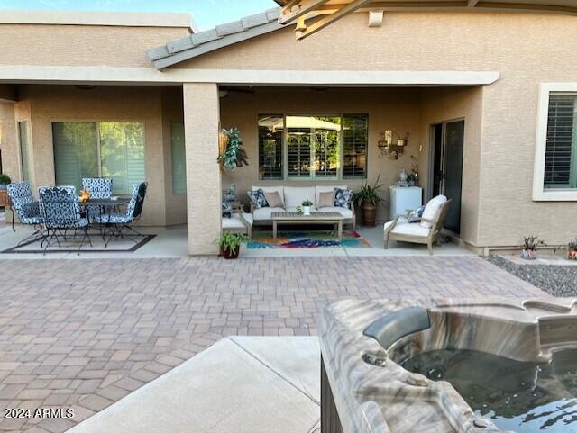 13622 West Merrell Street Avondale, AZ 85392 - Photo 3 of 15 a living room with furniture and a potted plant