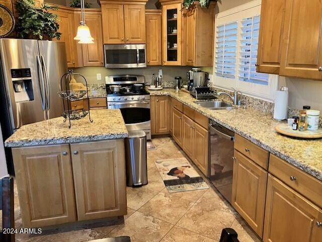 13622 West Merrell Street Avondale, AZ 85392 - Photo 5 of 15 a kitchen with stainless steel appliances granite countertop a sink stove refrigerator and a microwave