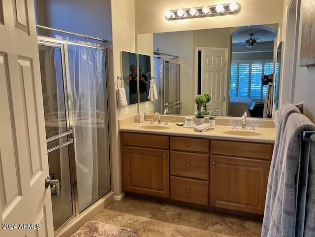 13622 West Merrell Street Avondale, AZ 85392 - Photo 9 of 15 a bathroom with a double vanity sink mirror and shower