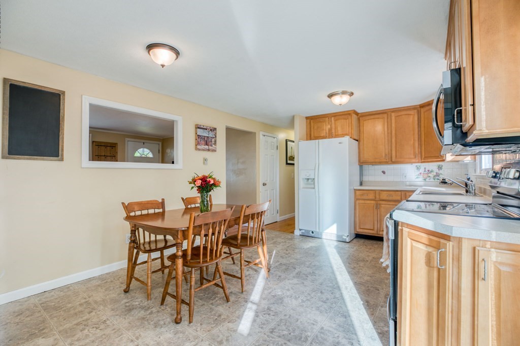 67 Aspen Road Springfield, MA 01128 - Photo 6 of 25 a view of a dining room with furniture and a chandelier