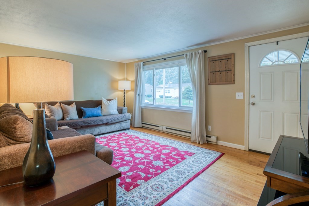 67 Aspen Road Springfield, MA 01128 - Photo 8 of 25 a living room with furniture and wooden floor