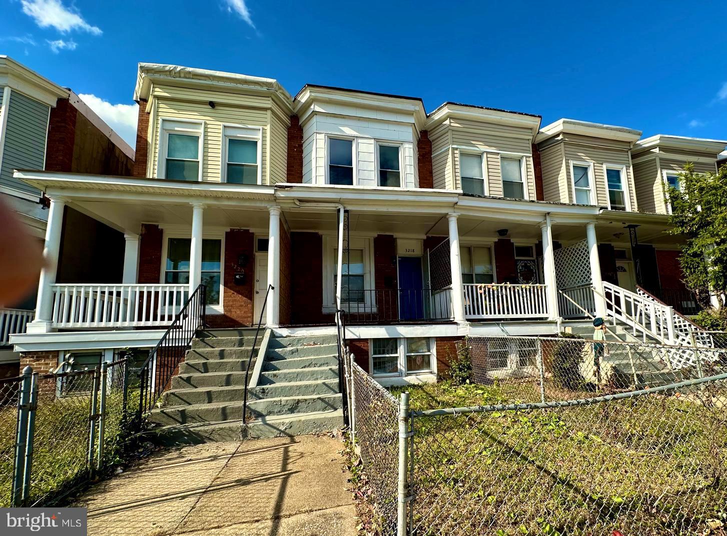 a view of a brick house with many windows
