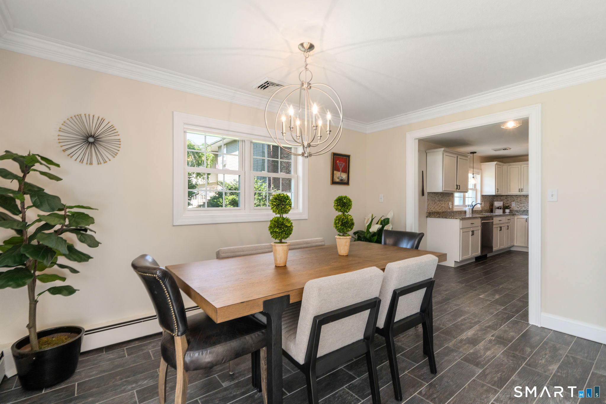 31 Cowan Street Suffield, CT 06078 - Photo 10 of 29 a view of a dining room with furniture window and wooden floor