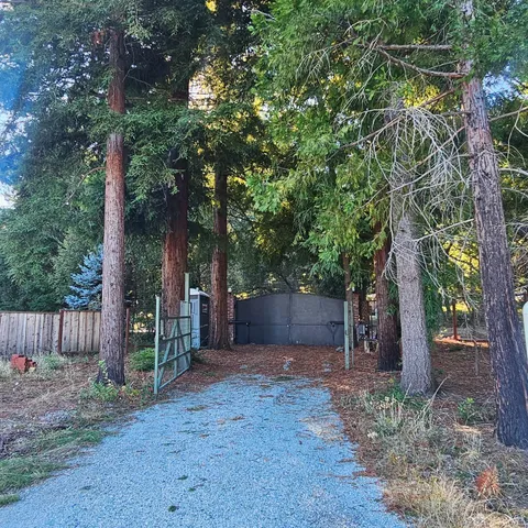 a backyard of a house with lots of green space