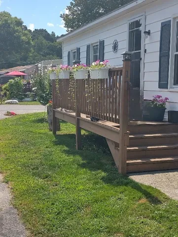 a front view of house with yard and seating area