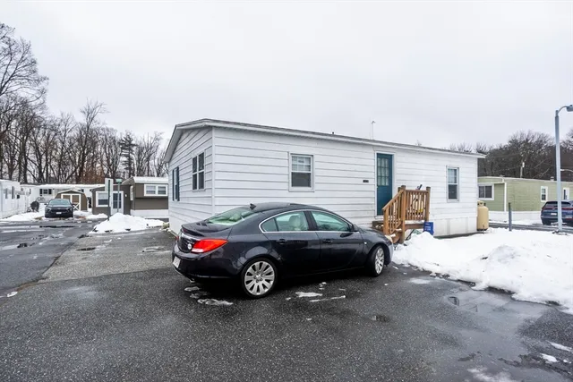 a view of a car parked in front of a house