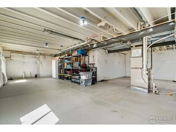 a bathroom with a double vanity sink toilet and a mirror