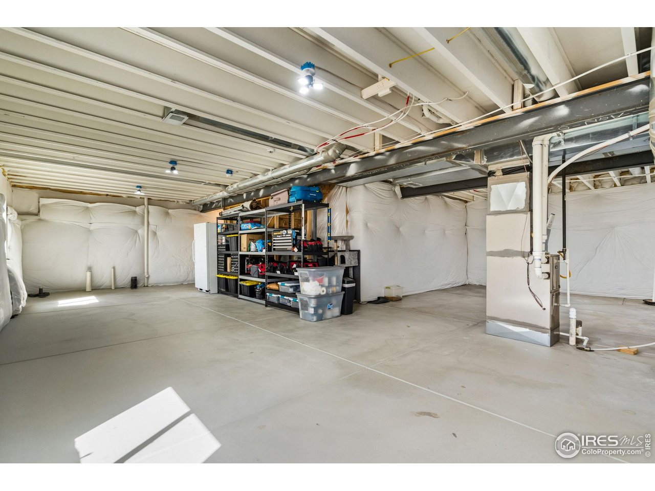 1233 Lily Mountain Road Severance, CO 80550 - Photo 30 of 44 a view of empty room with wooden ceiling