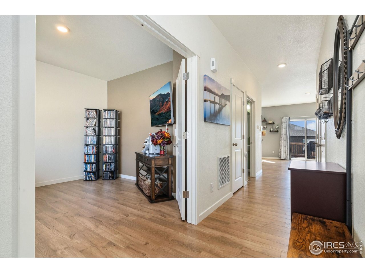 1233 Lily Mountain Road Severance, CO 80550 - Photo 5 of 44 a view of a livingroom with furniture and an empty room