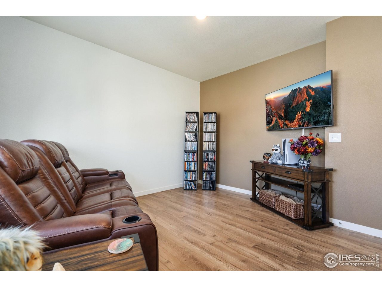 1233 Lily Mountain Road Severance, CO 80550 - Photo 6 of 44 a living room with furniture and a flat screen tv