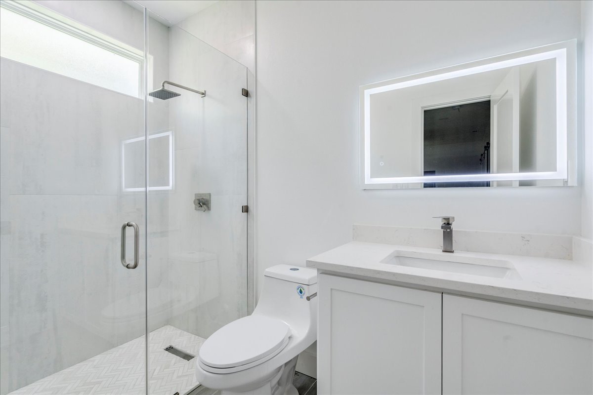 1215 Howard Street Taylor, TX 76574 - Photo 24 of 37 Full Bathroom on the first floor of the garage with easy access to the yard
