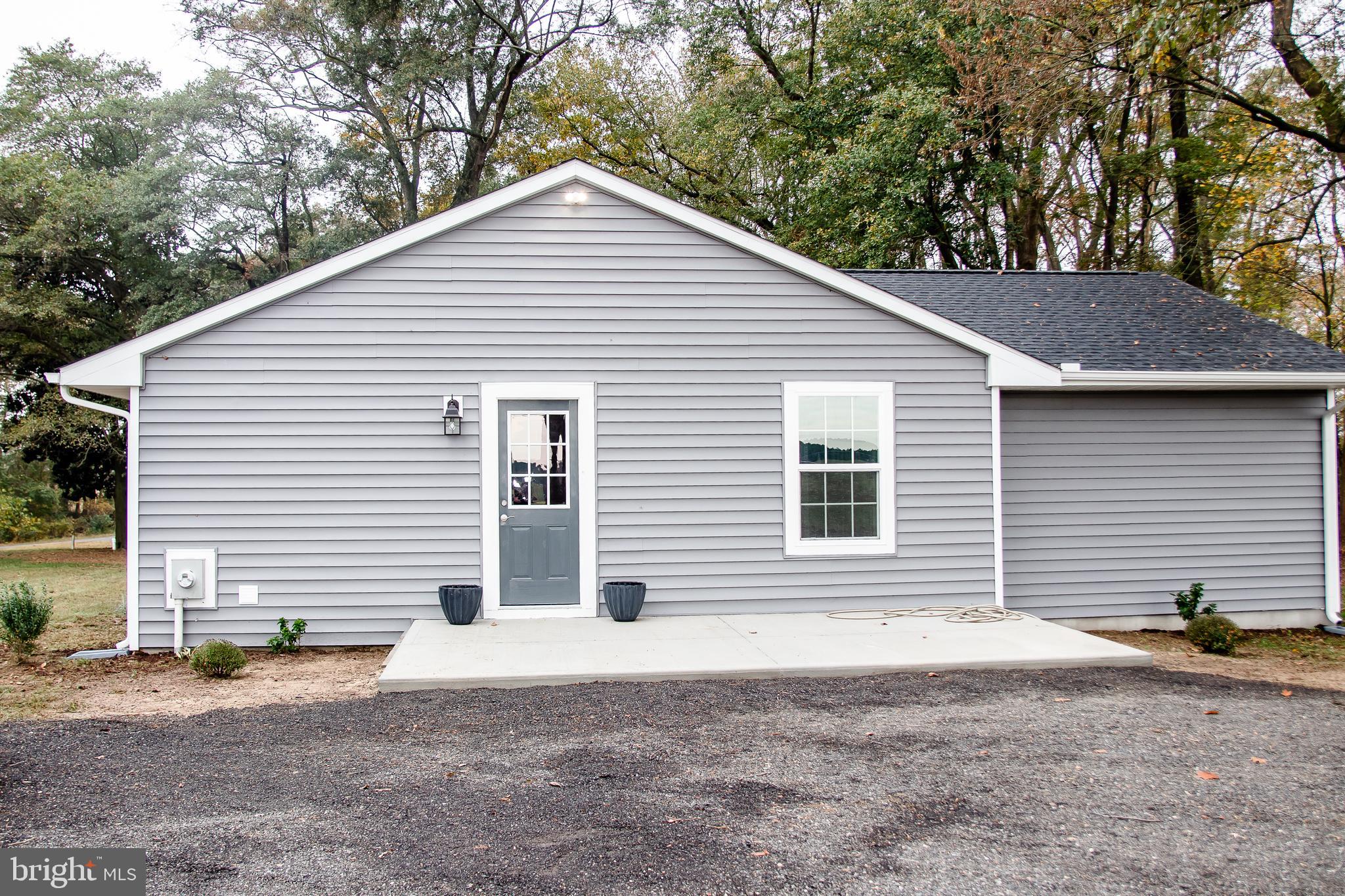 21398 Tanyard Road Preston, MD 21655 - Photo 3 of 27 Side entrance with 10x20 concrete patio