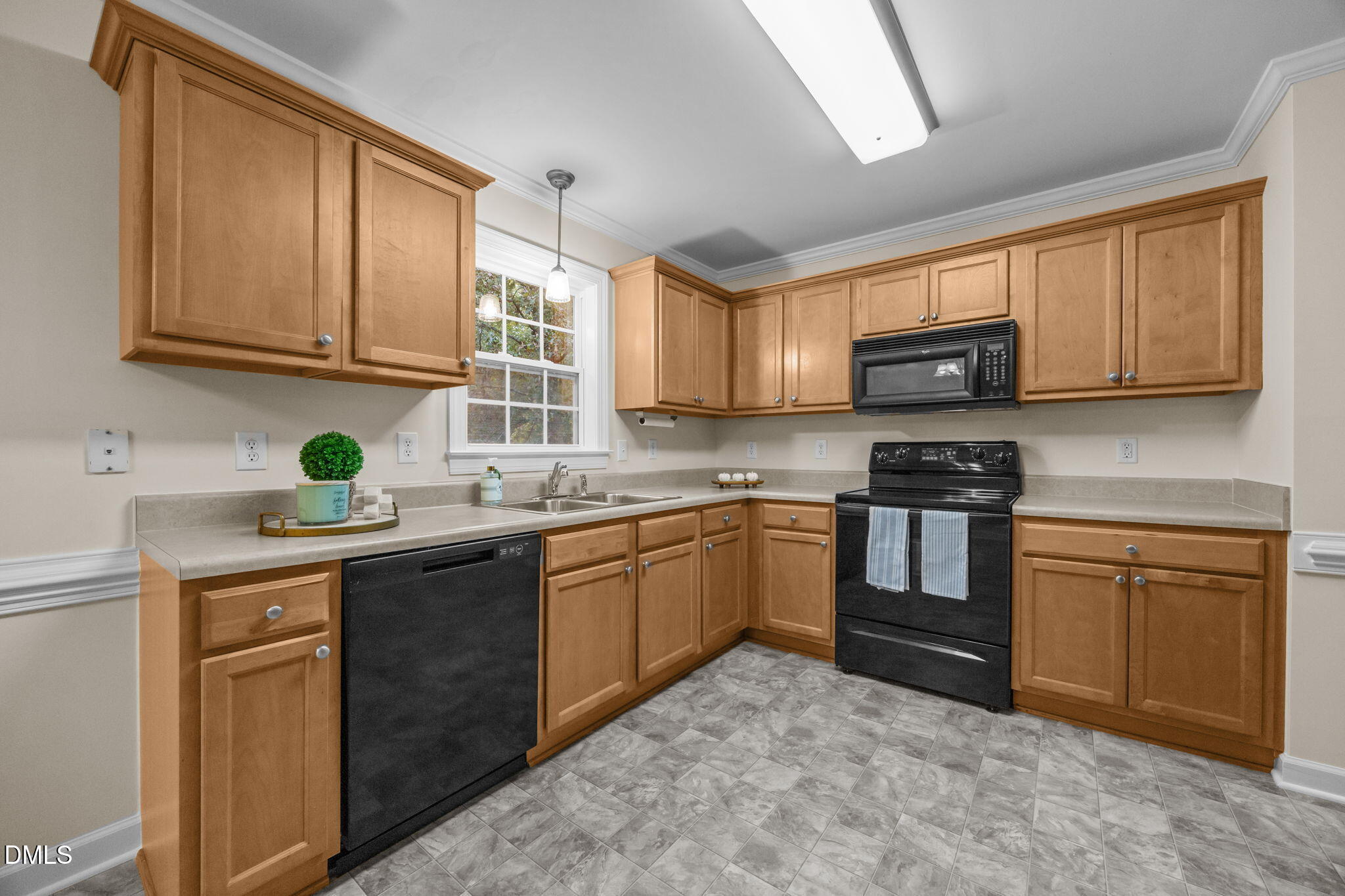 505 Vinson Road Clayton, NC 27527 - Photo 9 of 31 a kitchen with granite countertop a sink stainless steel appliances and cabinets