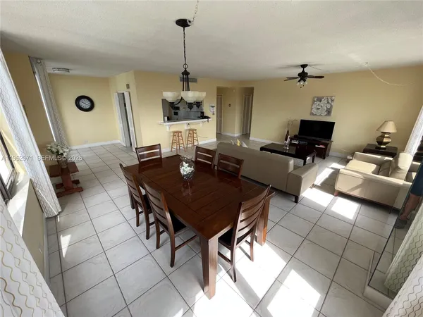 a view of a workspace with furniture and rug