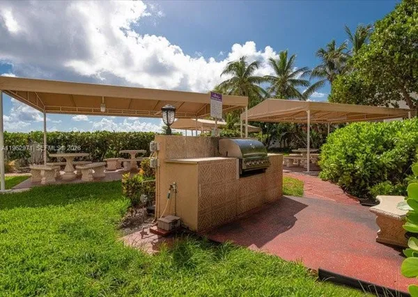 a view of a backyard with garden and patio