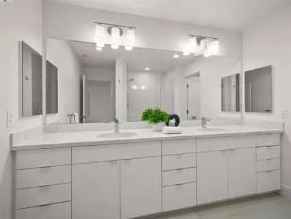 a bathroom with a sink vanity and a mirror
