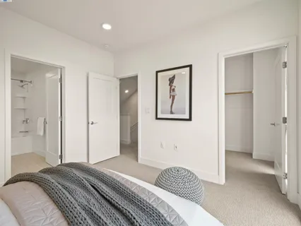 a bedroom with a bed and hallway