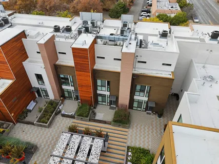 an aerial view of a house with balcony and garage