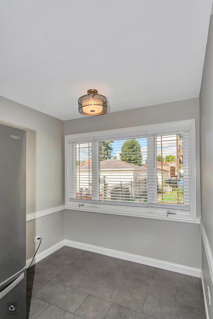 10348 South Rhodes Avenue Chicago, IL 60628 - Photo 12 of 20 an empty room with a window