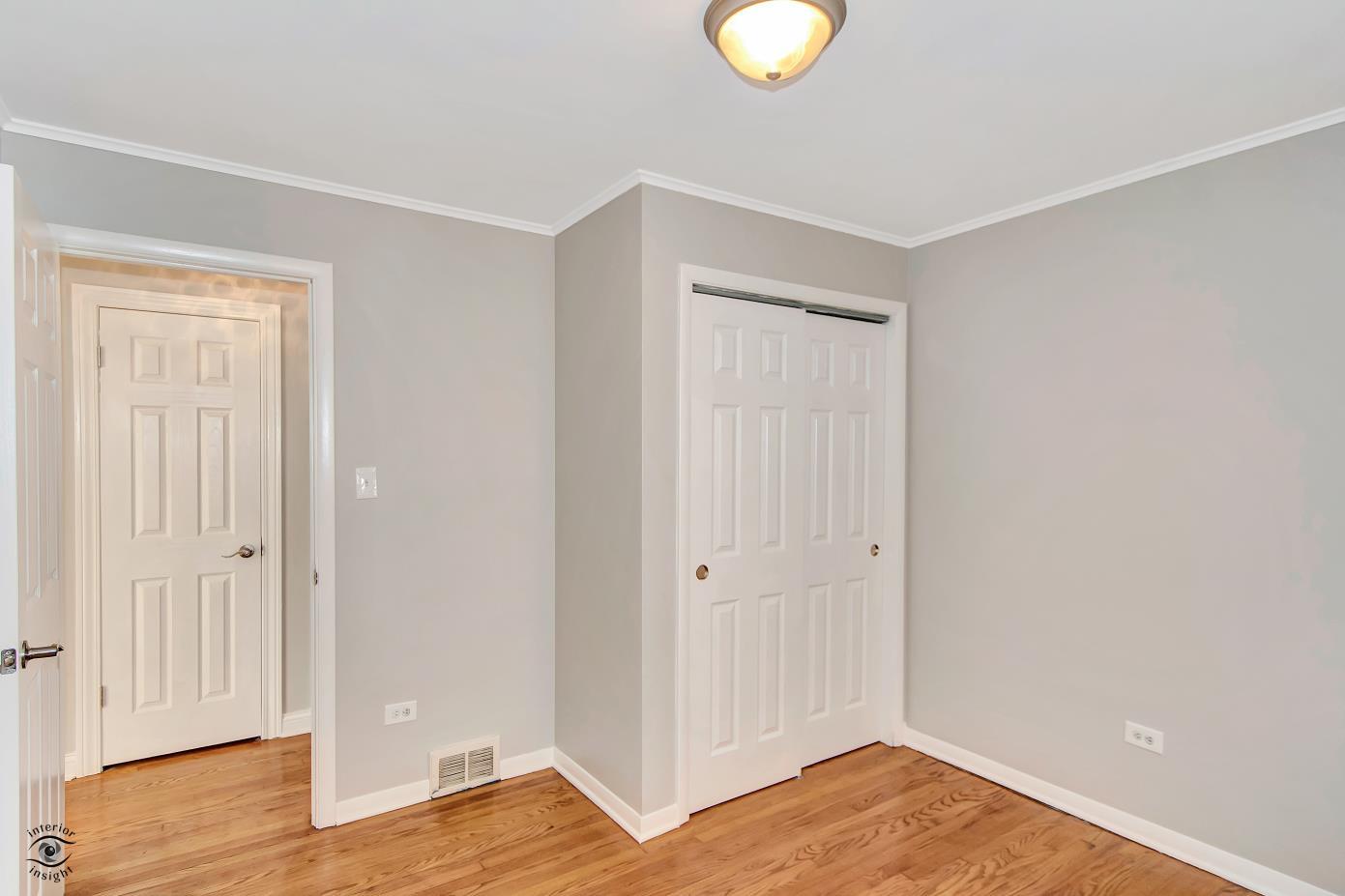 10348 South Rhodes Avenue Chicago, IL 60628 - Photo 8 of 20 a view of a livingroom with wooden floor