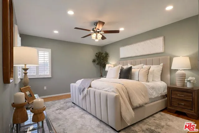 a bedroom with bed and window