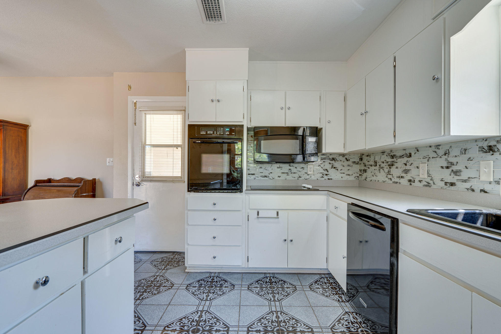 236 Deluna Road Southwest Fort Walton Beach, FL 32548 - Photo 12 of 26 a kitchen with granite countertop white cabinets and white appliances
