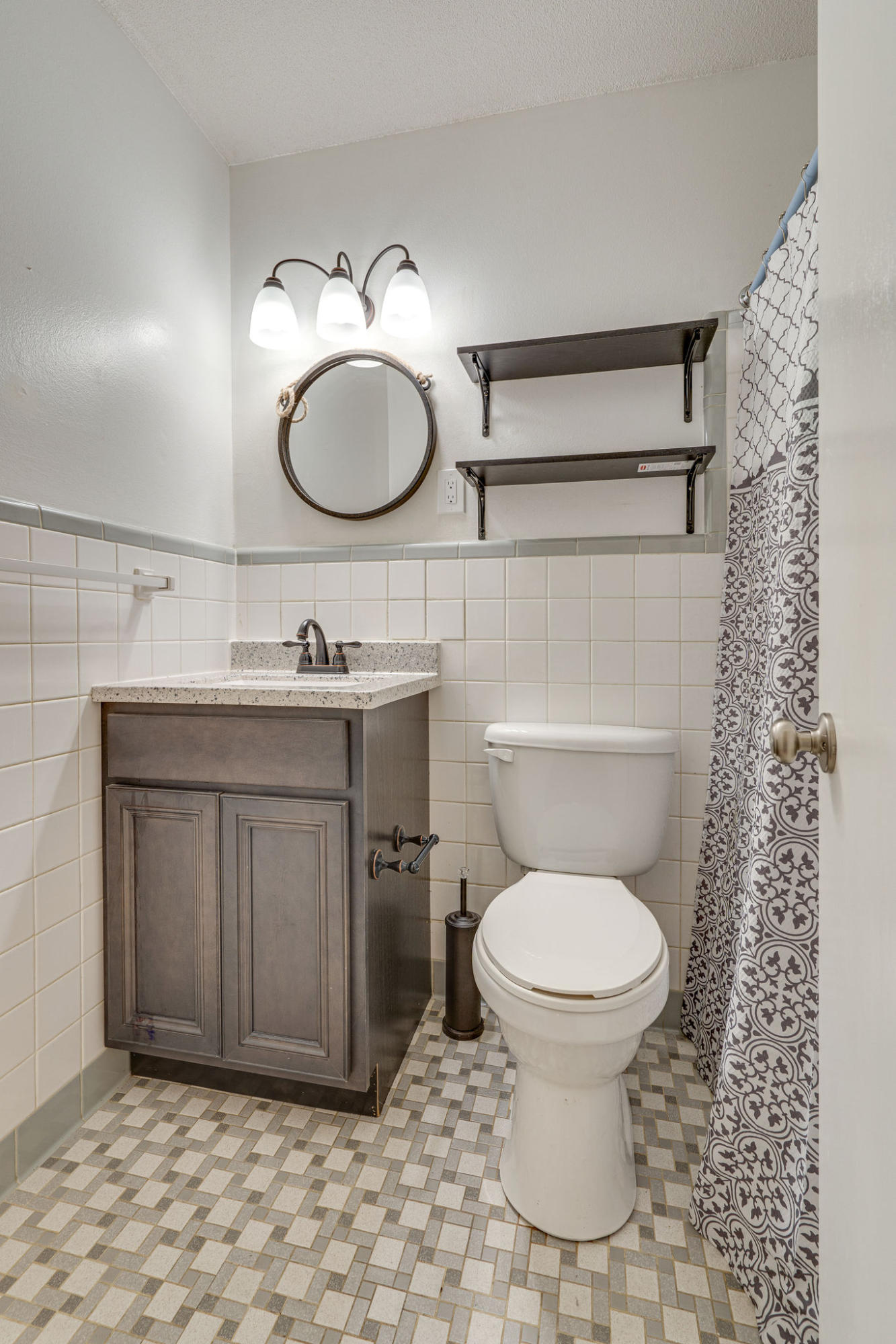 236 Deluna Road Southwest Fort Walton Beach, FL 32548 - Photo 17 of 26 a bathroom with a toilet sink and mirror