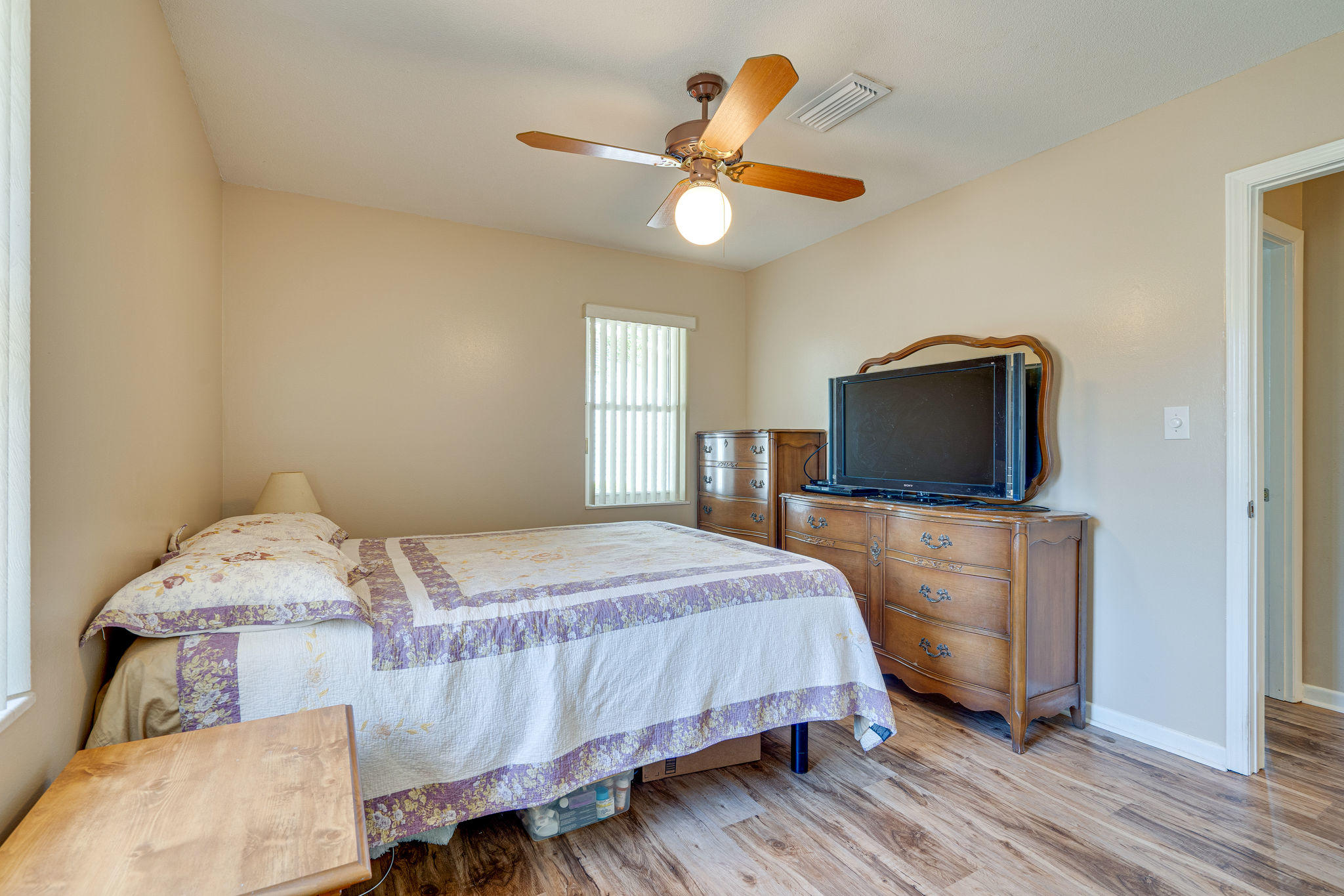 236 Deluna Road Southwest Fort Walton Beach, FL 32548 - Photo 19 of 26 a bedroom with a bed and a flat screen tv