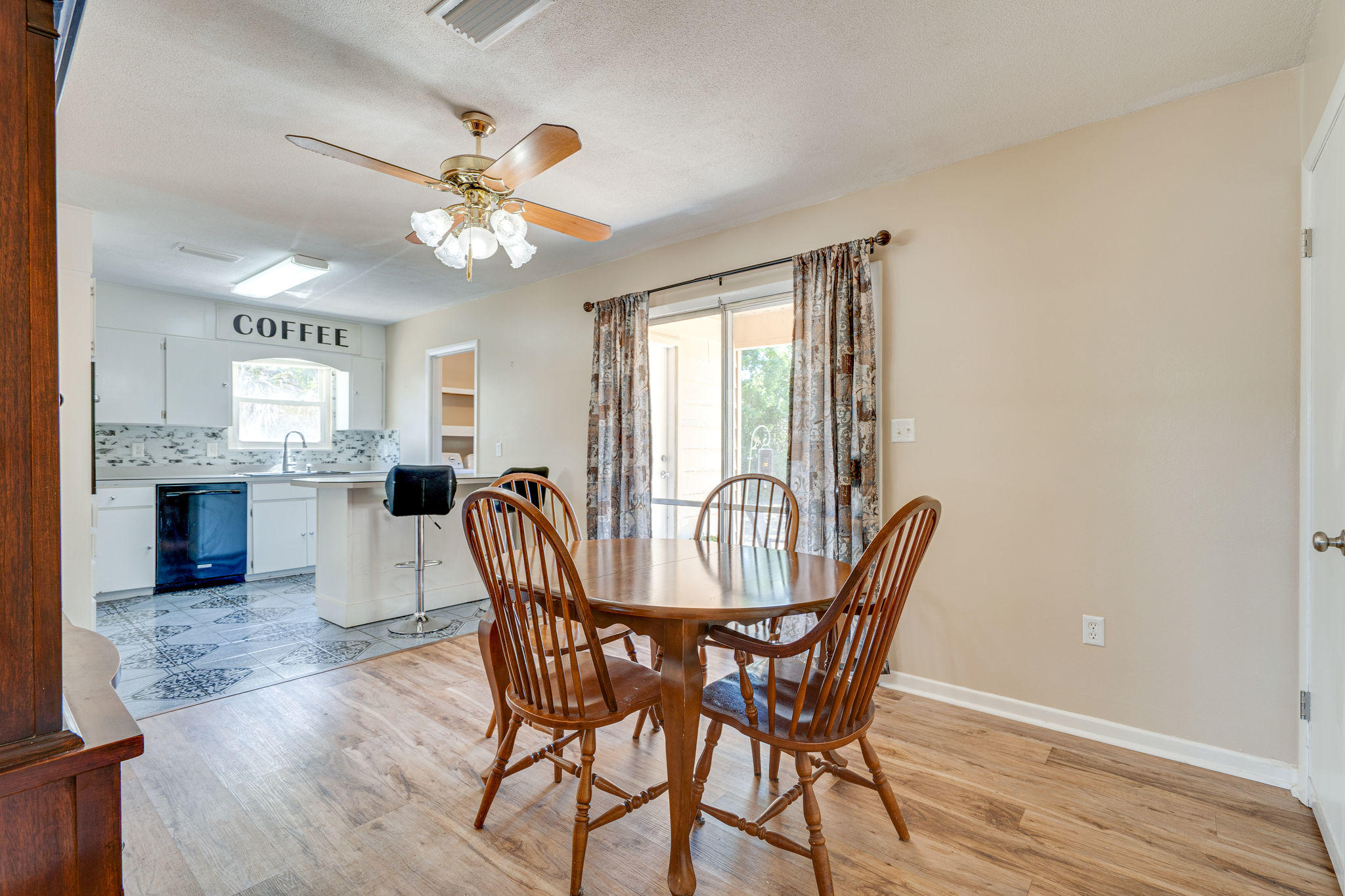 236 Deluna Road Southwest Fort Walton Beach, FL 32548 - Photo 8 of 26 a view of a dining room with furniture window and wooden floor