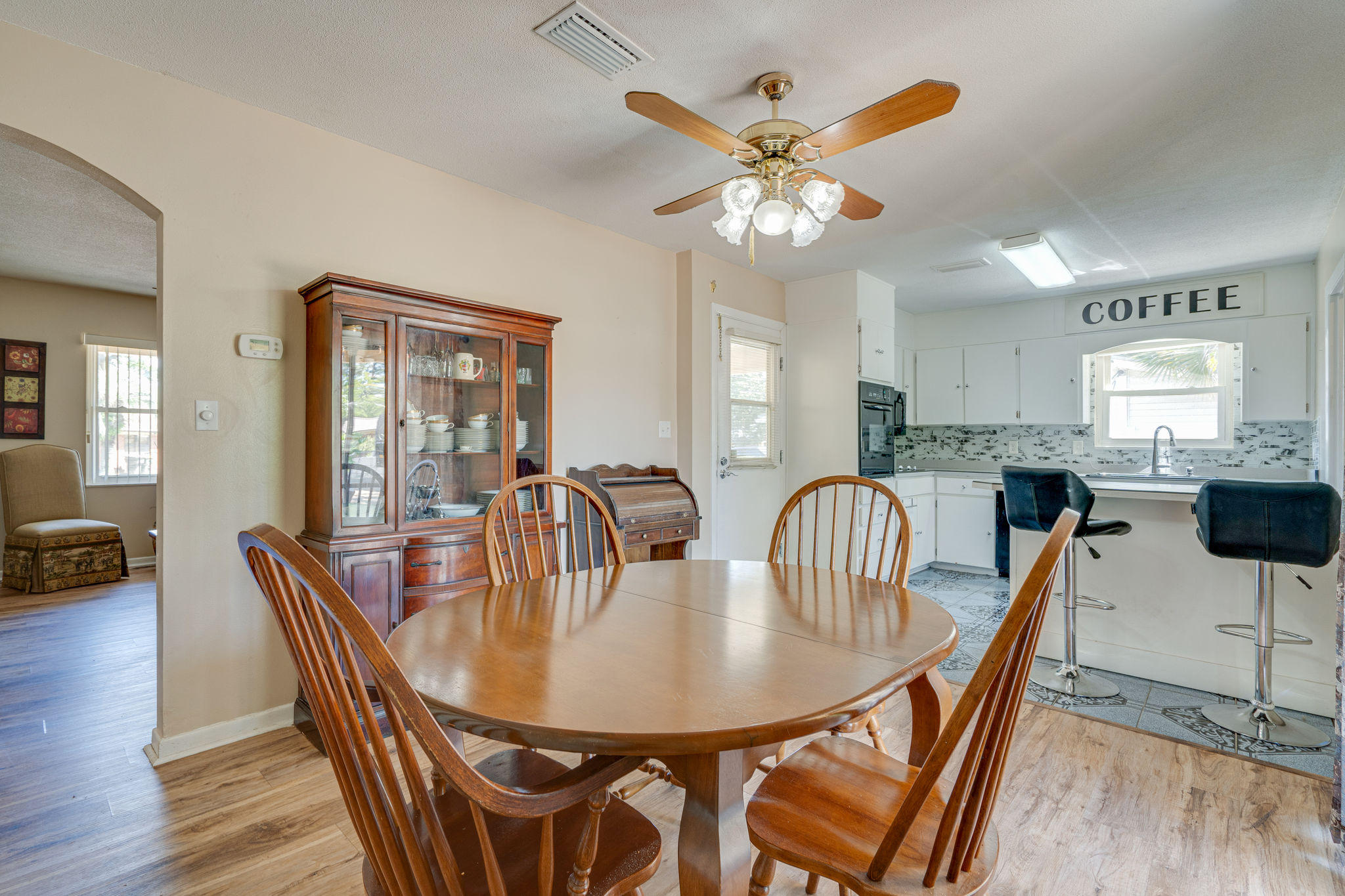 236 Deluna Road Southwest Fort Walton Beach, FL 32548 - Photo 9 of 26 a view of a a dining room with furniture window and wooden floor