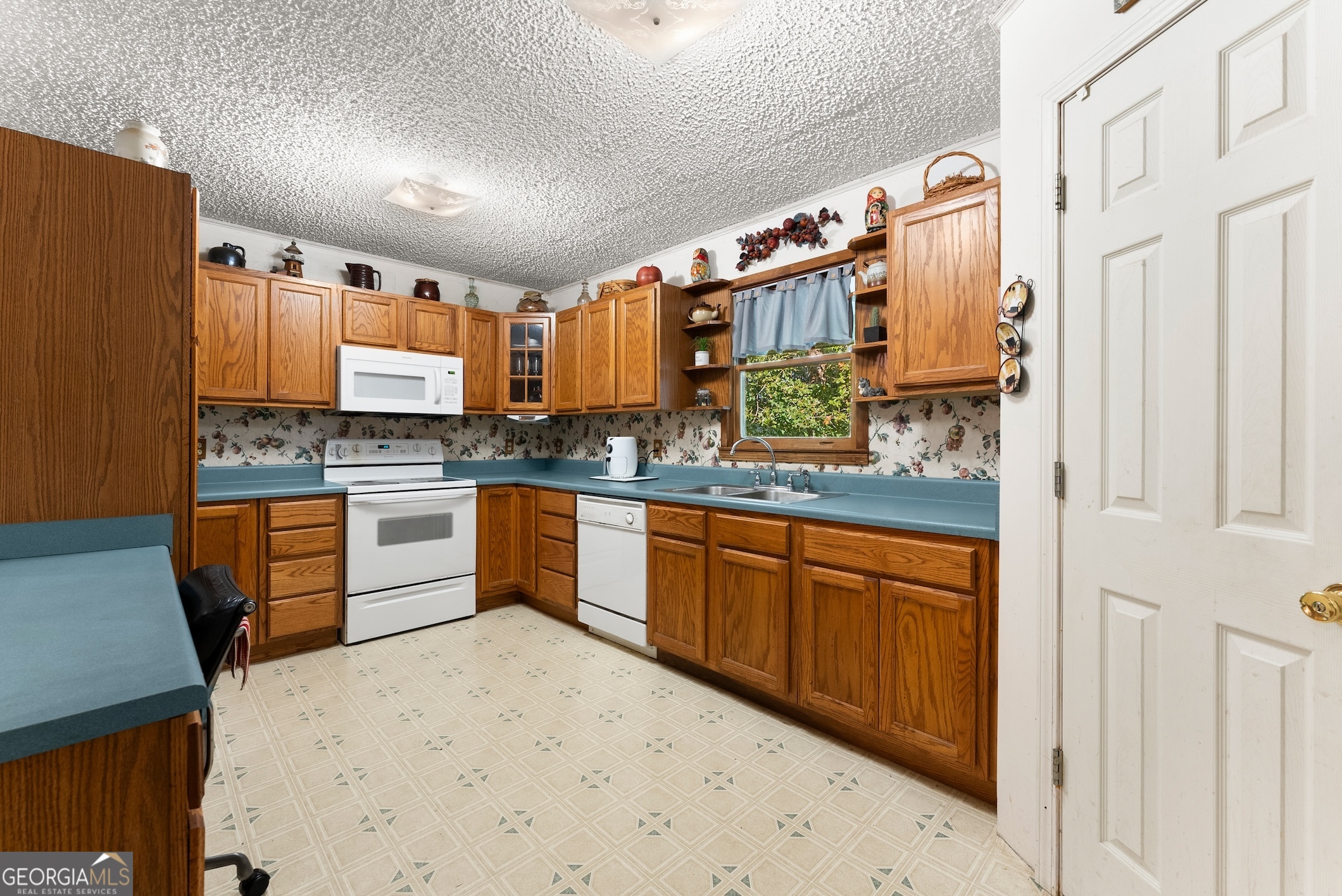 350 Old River Road Cornelia, GA 30531 - Photo 11 of 42 a kitchen with stainless steel appliances a sink and a refrigerator