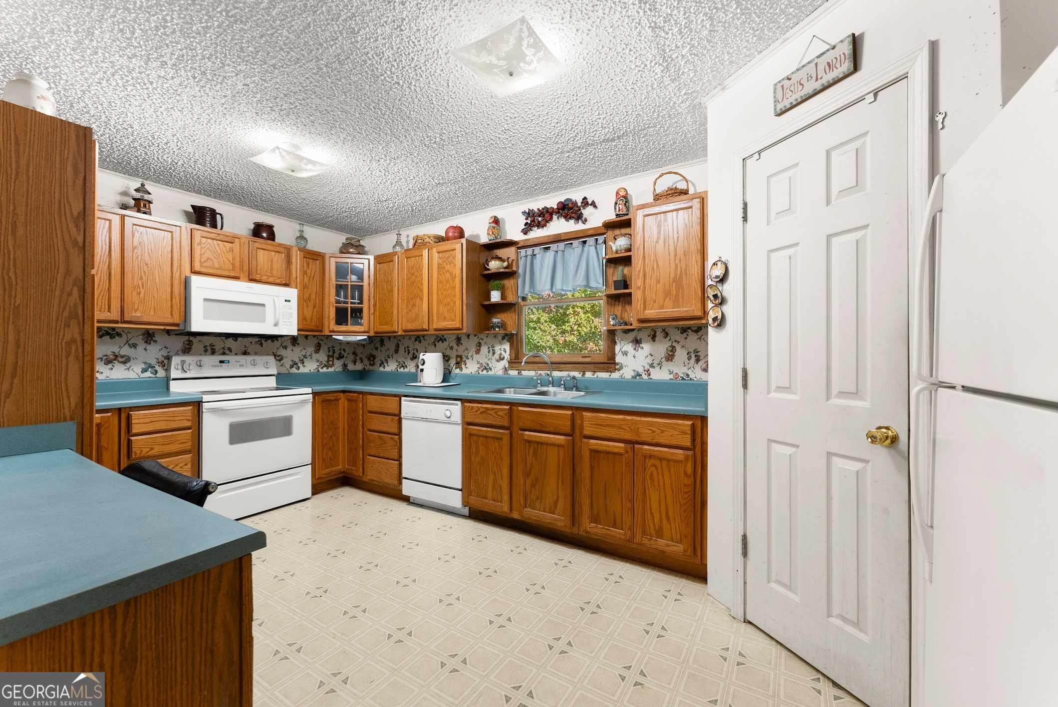 350 Old River Road Cornelia, GA 30531 - Photo 12 of 42 a kitchen with stainless steel appliances a refrigerator and cabinets