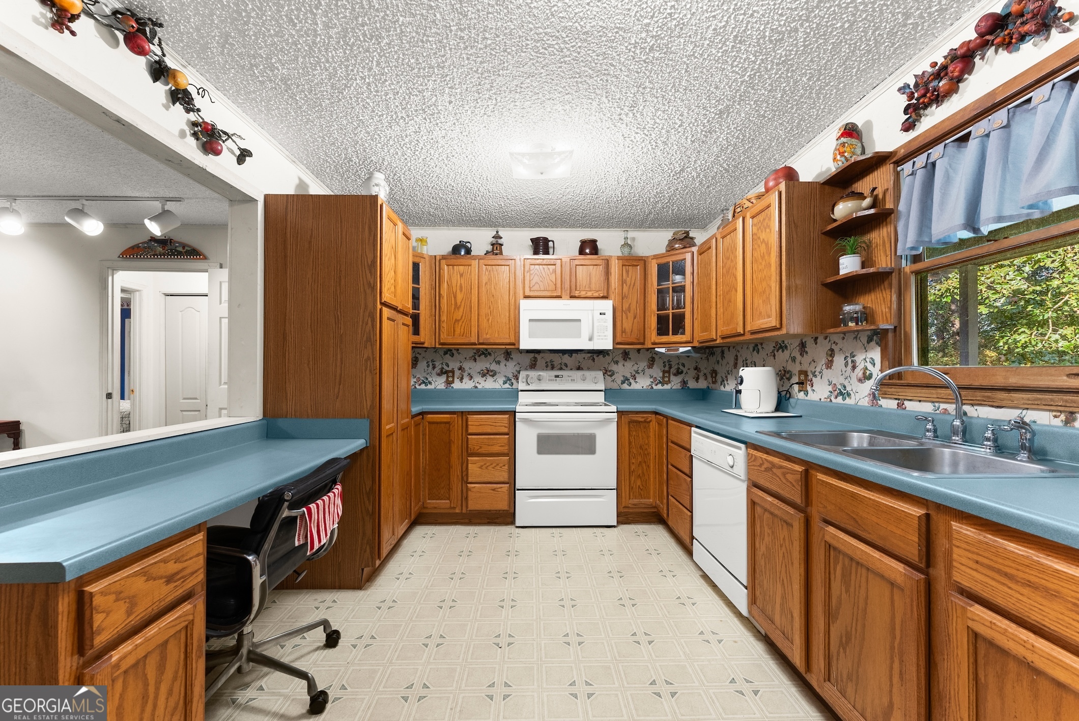 350 Old River Road Cornelia, GA 30531 - Photo 14 of 42 a large kitchen with stainless steel appliances granite countertop a sink counter space cabinets and a large window