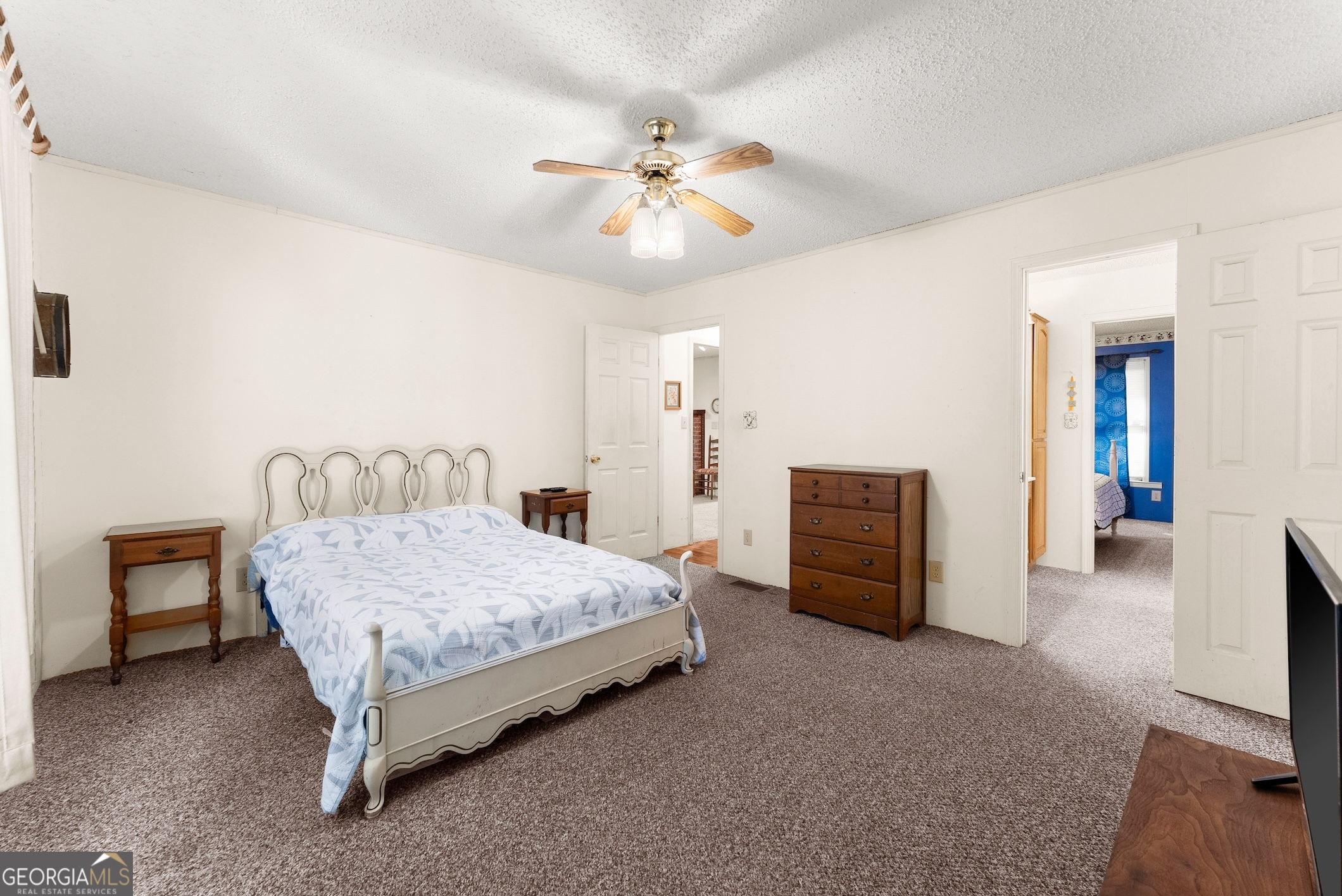 350 Old River Road Cornelia, GA 30531 - Photo 24 of 42 a bedroom with a bed and a chandelier
