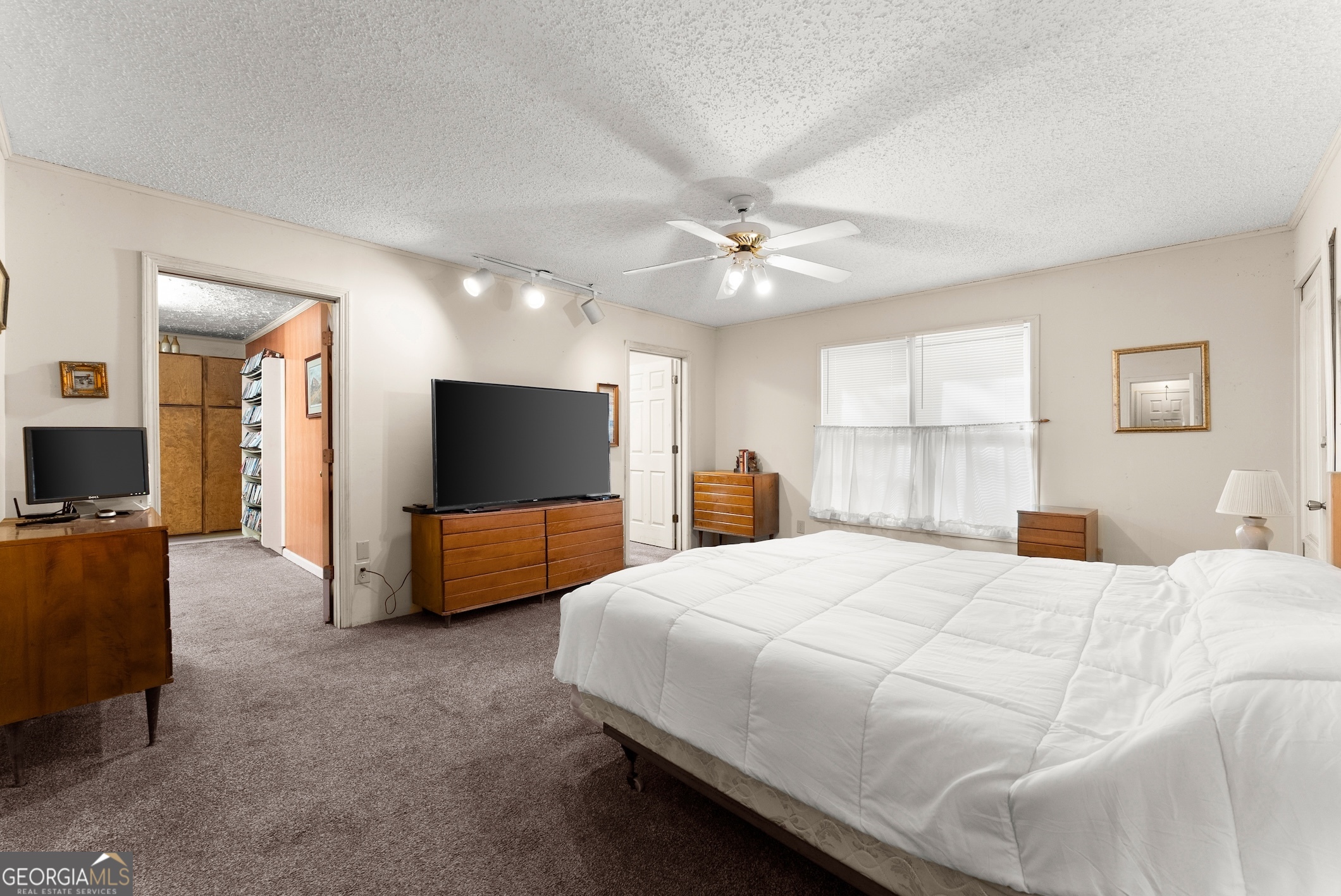 350 Old River Road Cornelia, GA 30531 - Photo 27 of 42 a bedroom with a bed and a flat screen tv