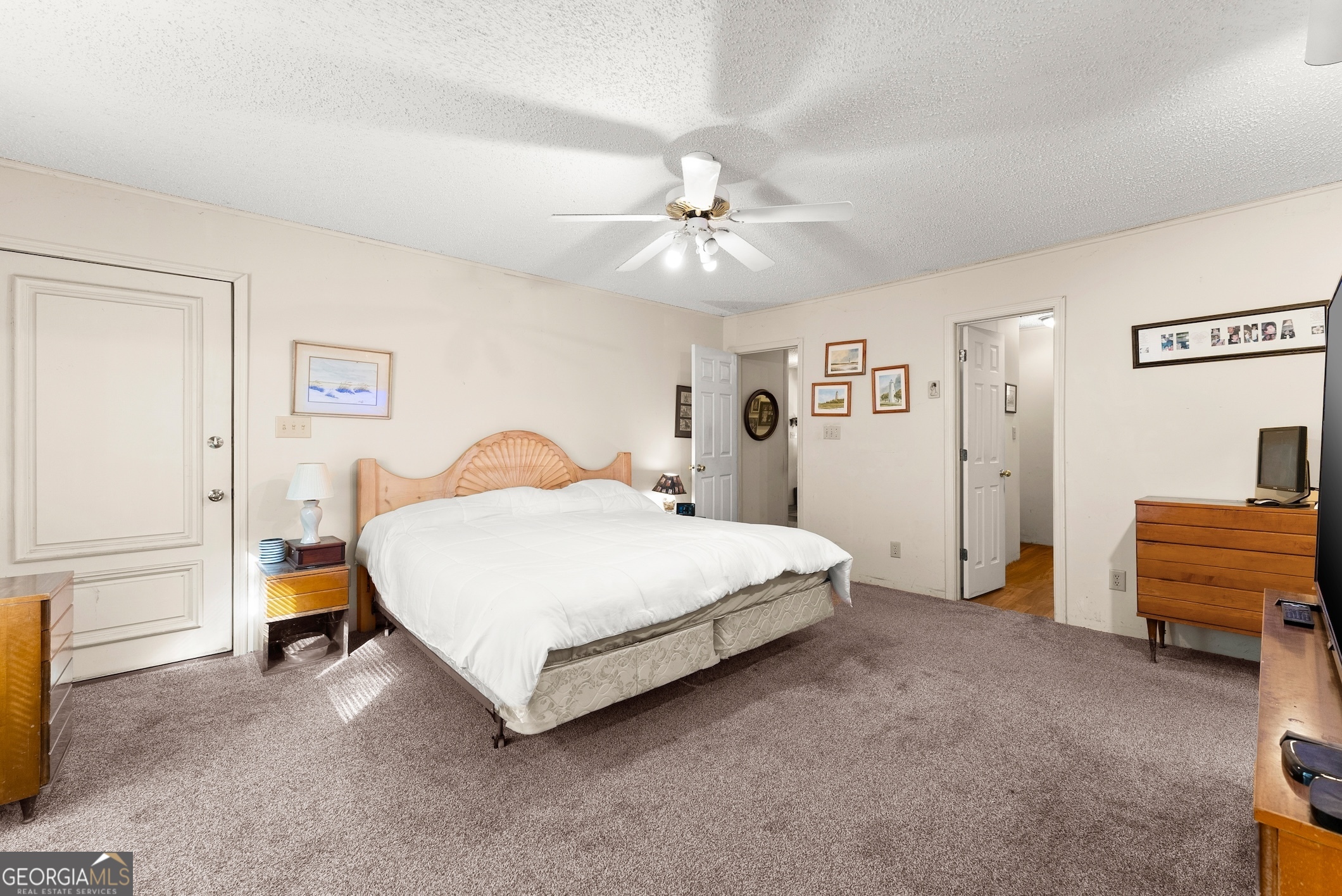 350 Old River Road Cornelia, GA 30531 - Photo 28 of 42 a bedroom with a bed and a chandelier