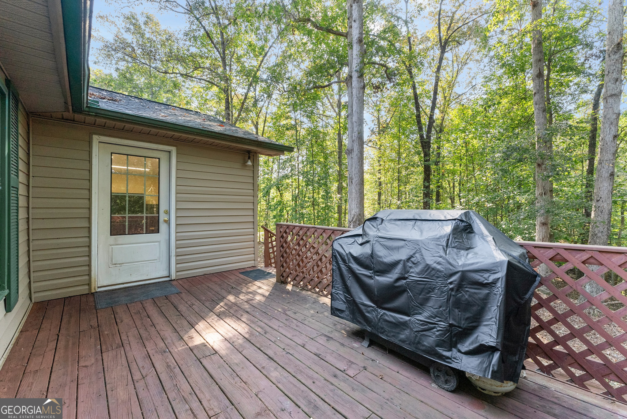 350 Old River Road Cornelia, GA 30531 - Photo 36 of 42 a view of a roof deck with wooden floor and fence
