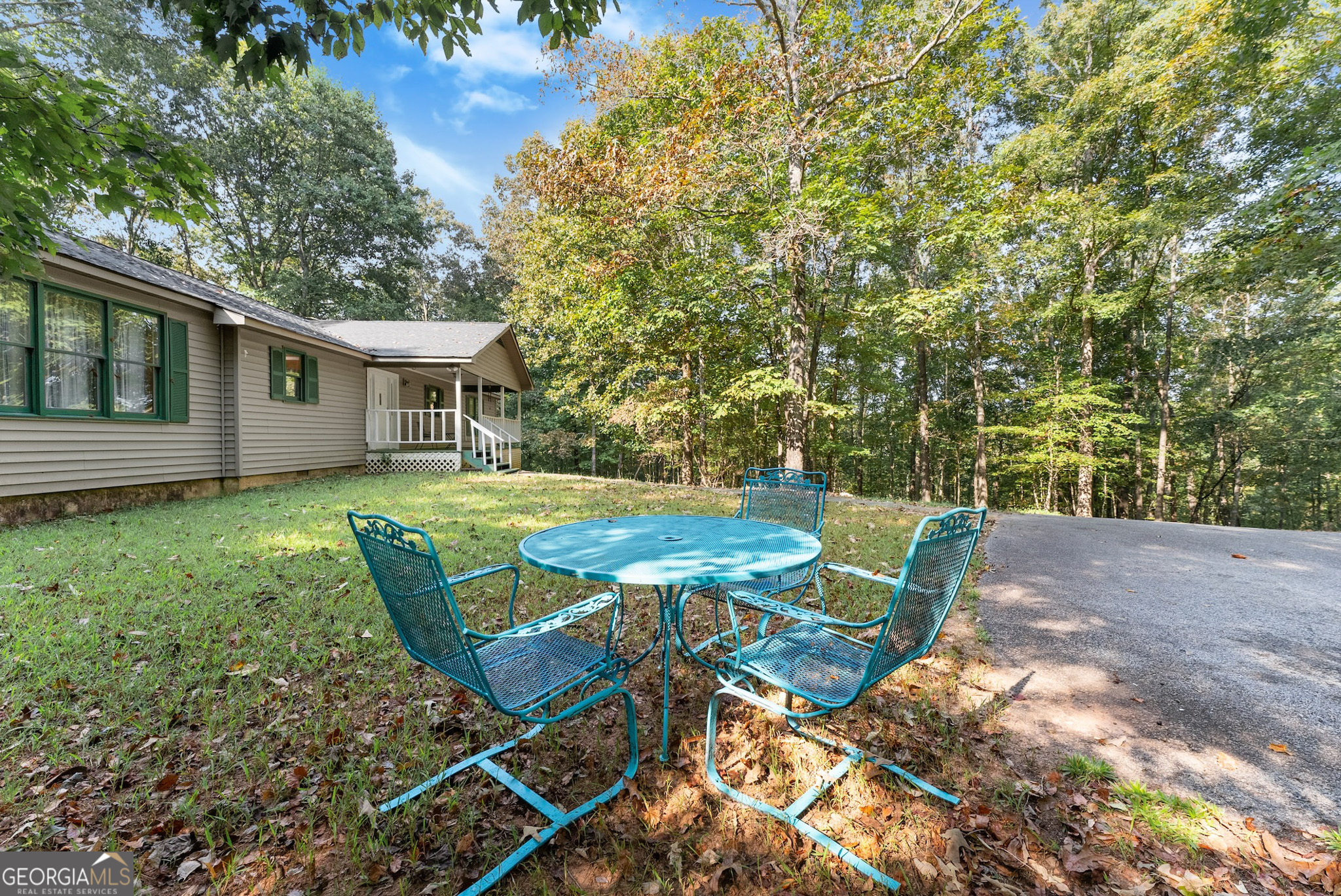 350 Old River Road Cornelia, GA 30531 - Photo 41 of 42 a view of a house with backyard sitting area and garden